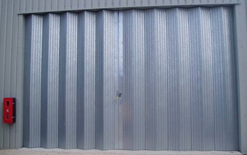 A set of galvanised metal folding shutter doors 