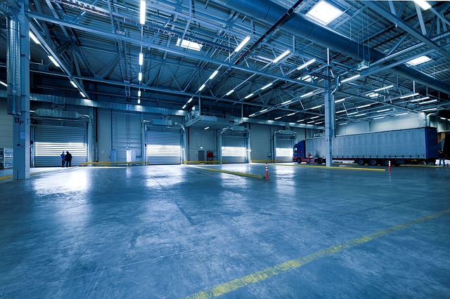 Inside a warehouse where a professional engineer is checking an automatic door. 